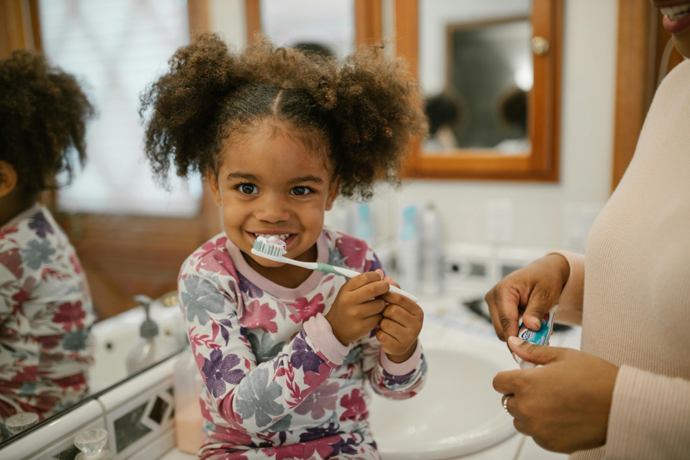 Young girl brushing teeth